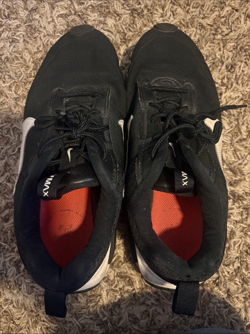 Nike Black Athletic Sneakers with White Swoosh and Red Insoles
